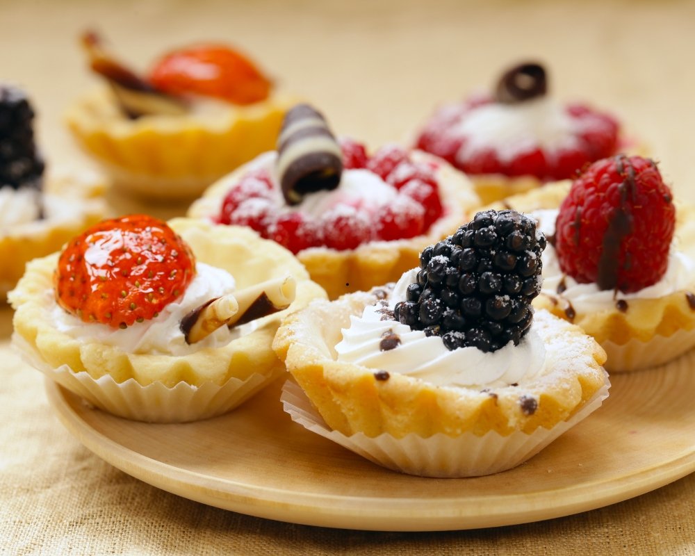 A tray of assorted pastries and desserts.