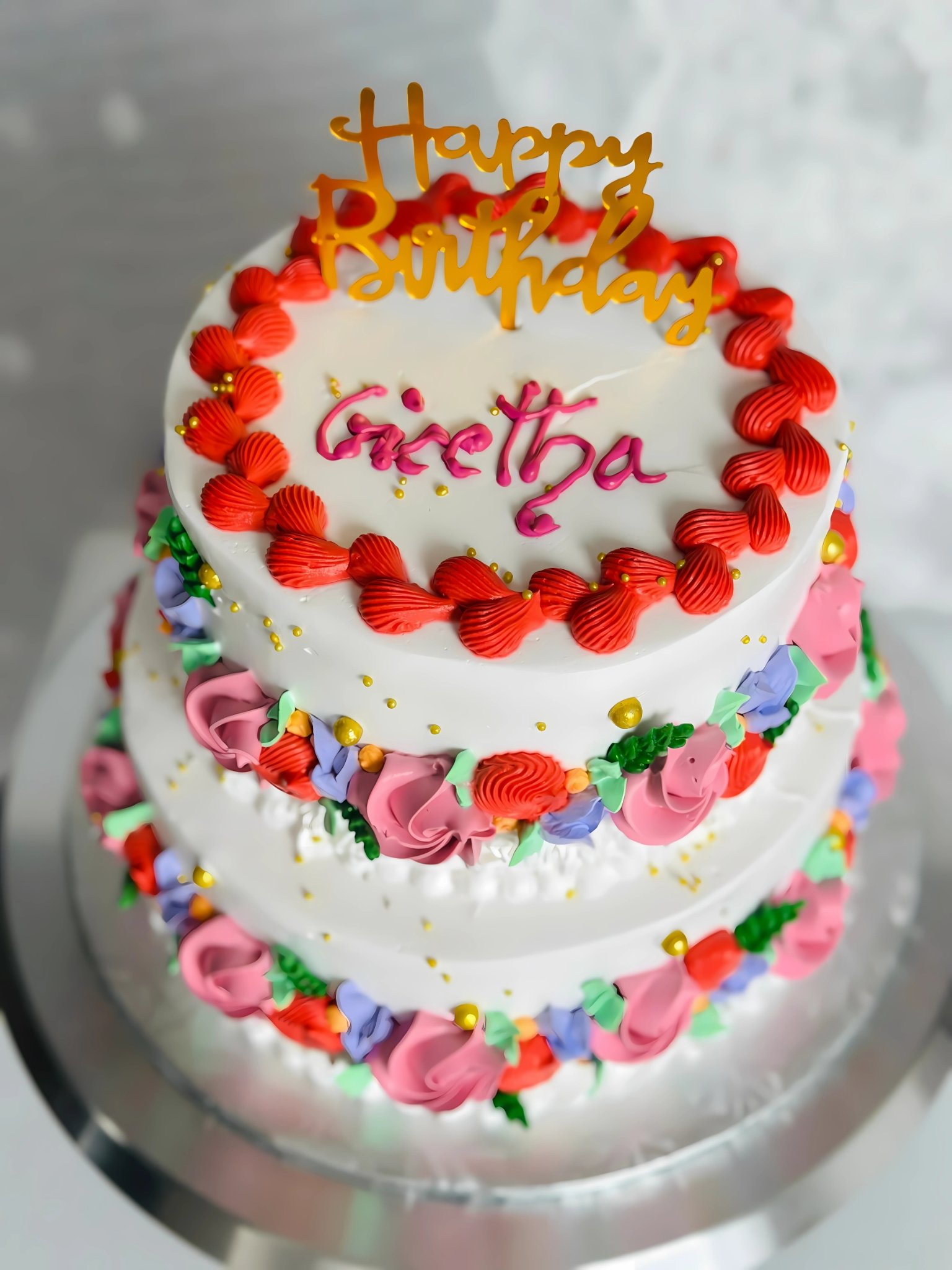 A vibrant fusion cake with unique decorations.